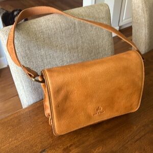 Oak &Tan leather shoulder purse with 26" strap. Great condition inside and out.